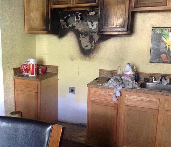 burned cabinets in kitchen of Jacksonville home
