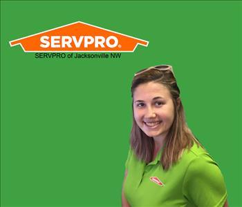 smiling young lady with brown hair in SERVPRO shirt